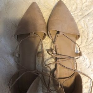 Tan suede flats with criss cross strings